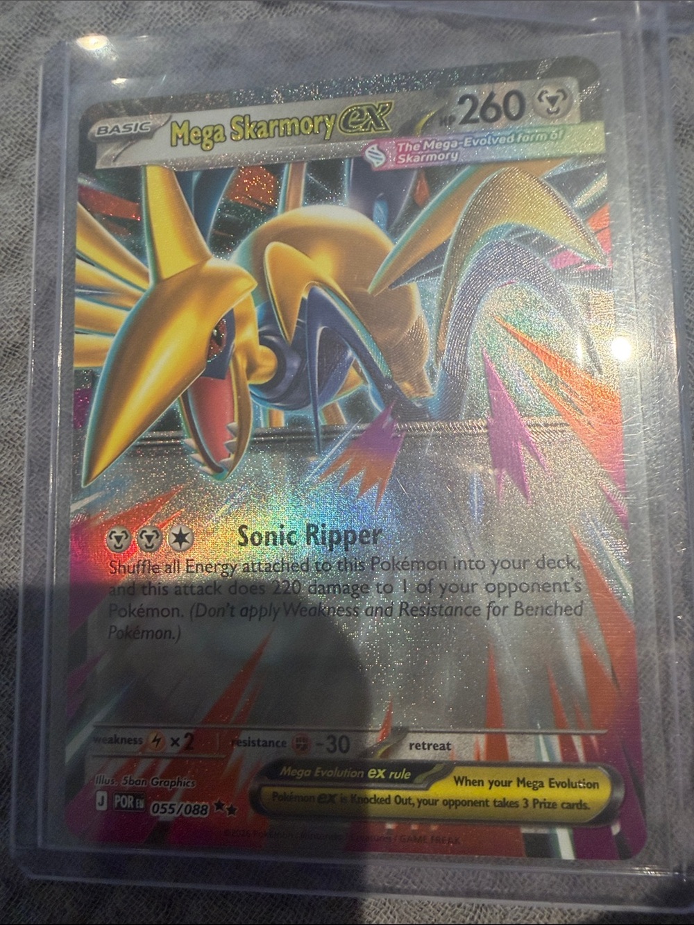 The card shows a Mega Skarmory ex (055/088) Double Rare holographic Pokémon card